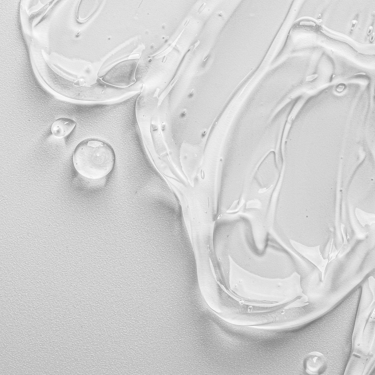 Close-up of clear, glossy essence texture swatch