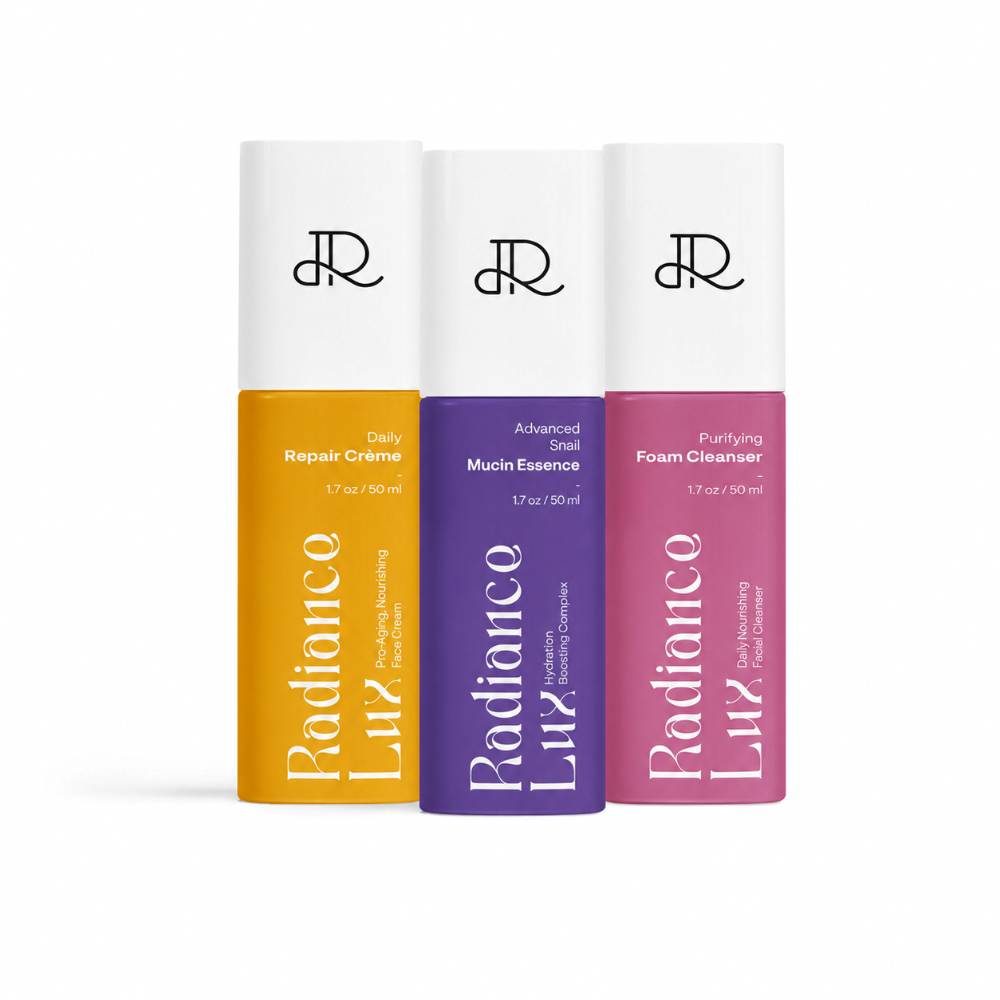 Radiance Lux Daily Repair Crème, Advanced Snail Mucin Essence and Purifying Foam Cleanser bottles in a row, the Triple Fighting Protection set
