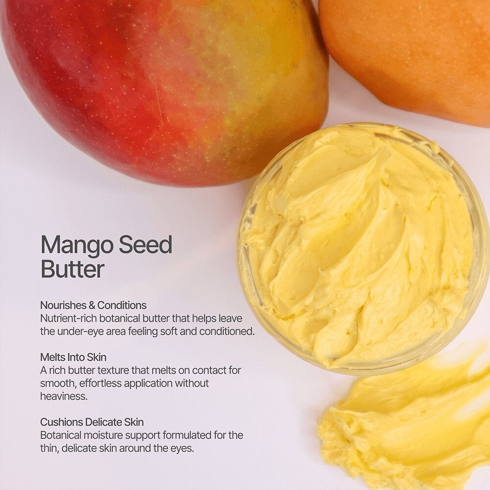 Mango seed butter in a bowl beside ripe mangoes, a key ingredient in Radiance Under Eye Balm